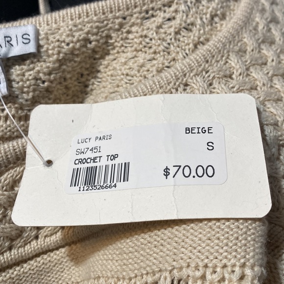 This is a very soft sweater the material is soft. It is beige size x small - Picture 5 of 5